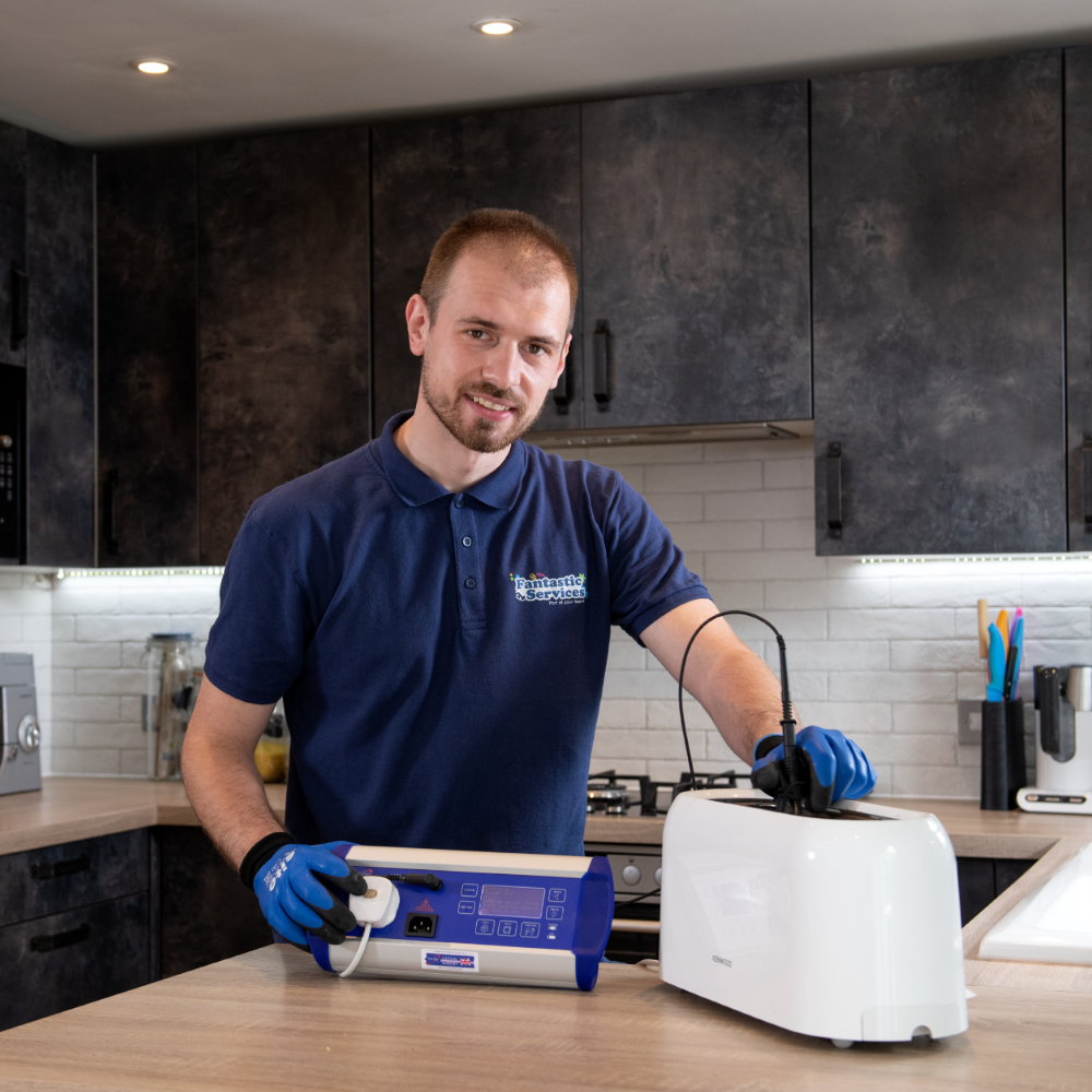 David Miloshev with a kettle and plug socket