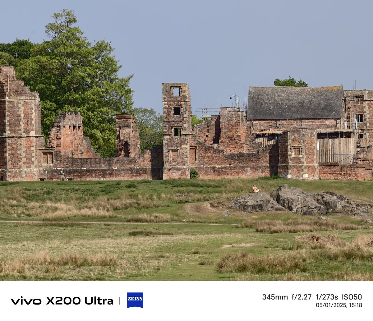 Old ruins in the distance across a field
