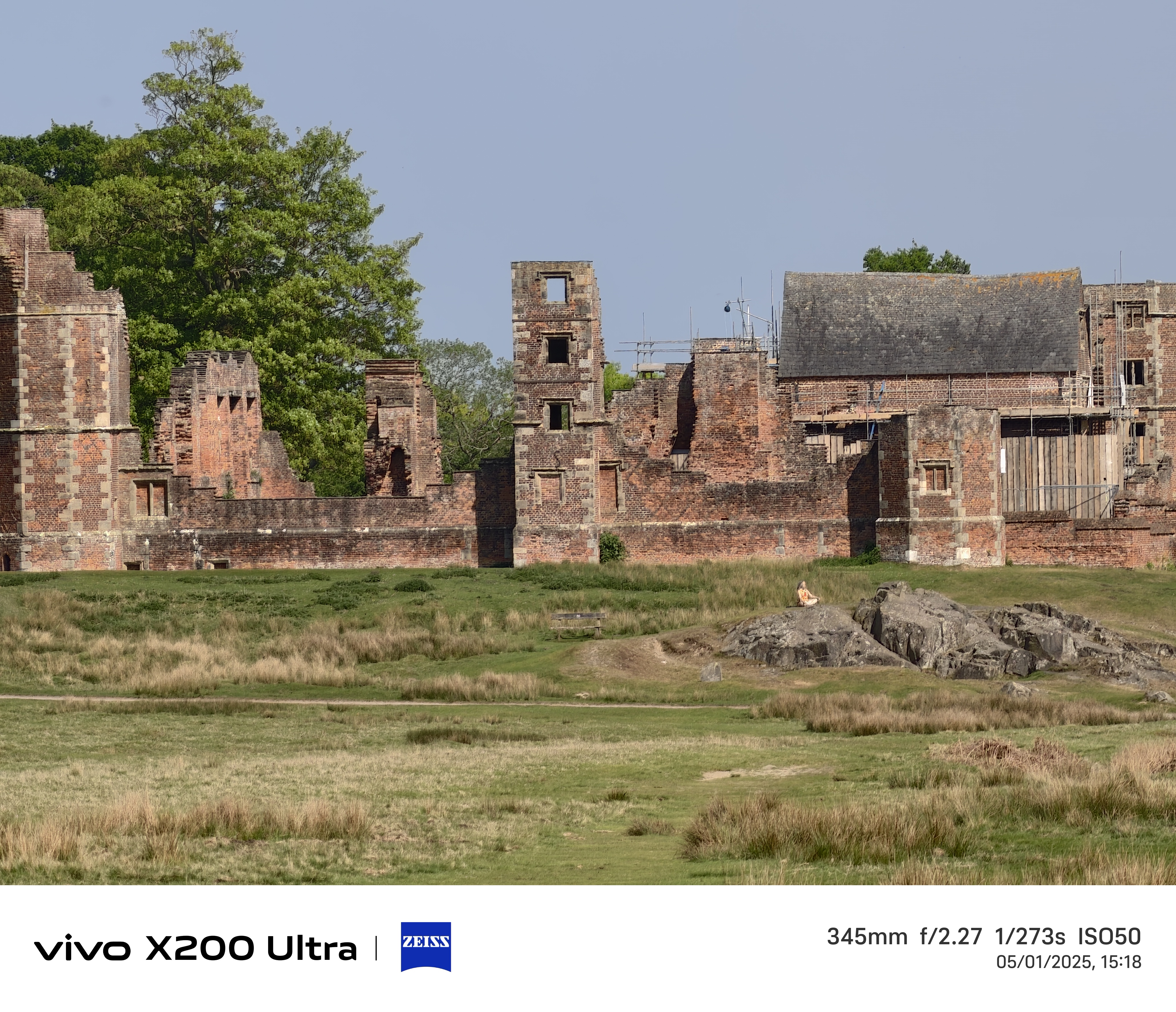 Old ruins in the distance across a field