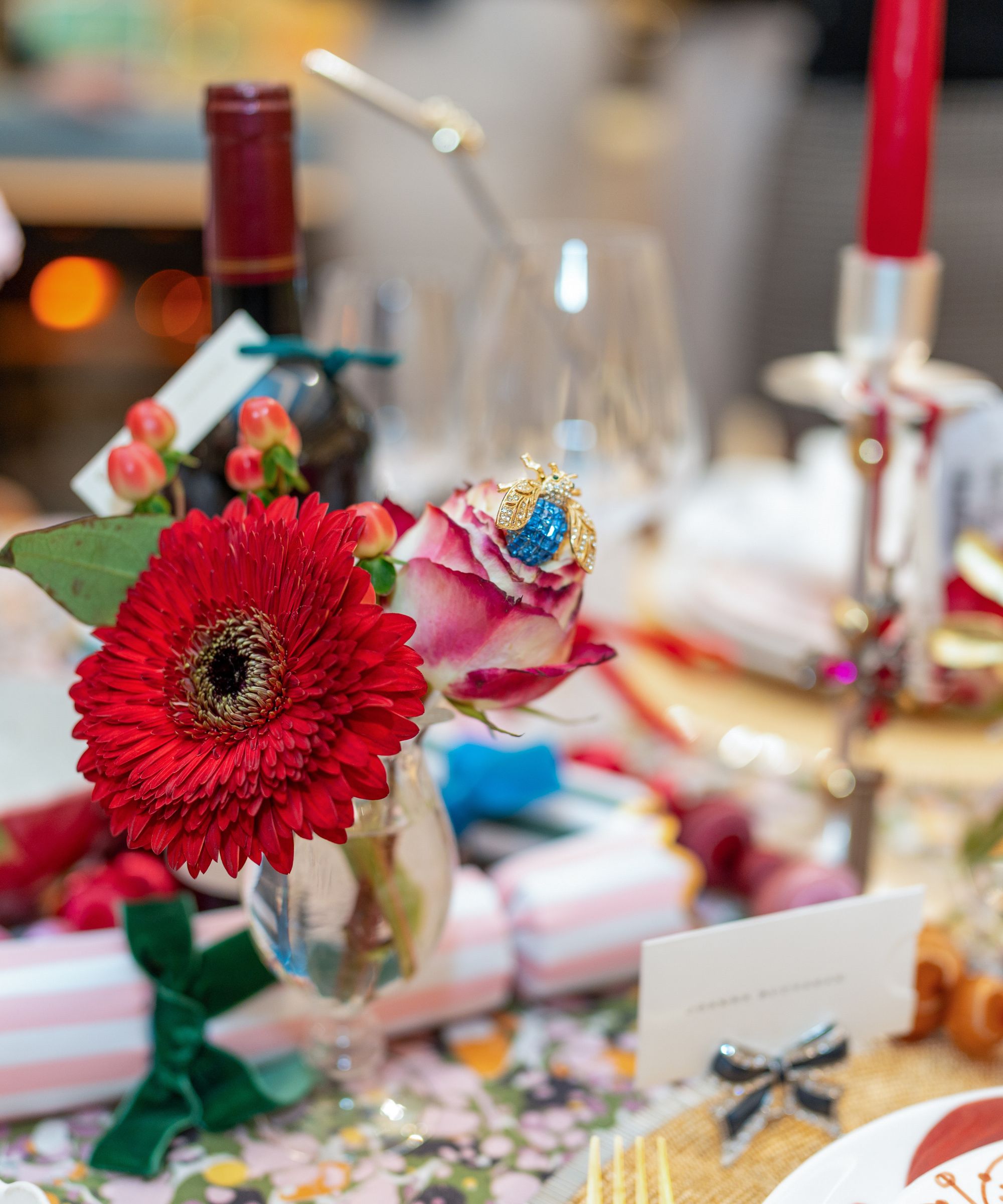 Red and pink table setting with gerberas and jewel details