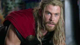 Thor bends down with his mouth open and a dead-eyed stare