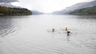cold-water swimmers in a lake