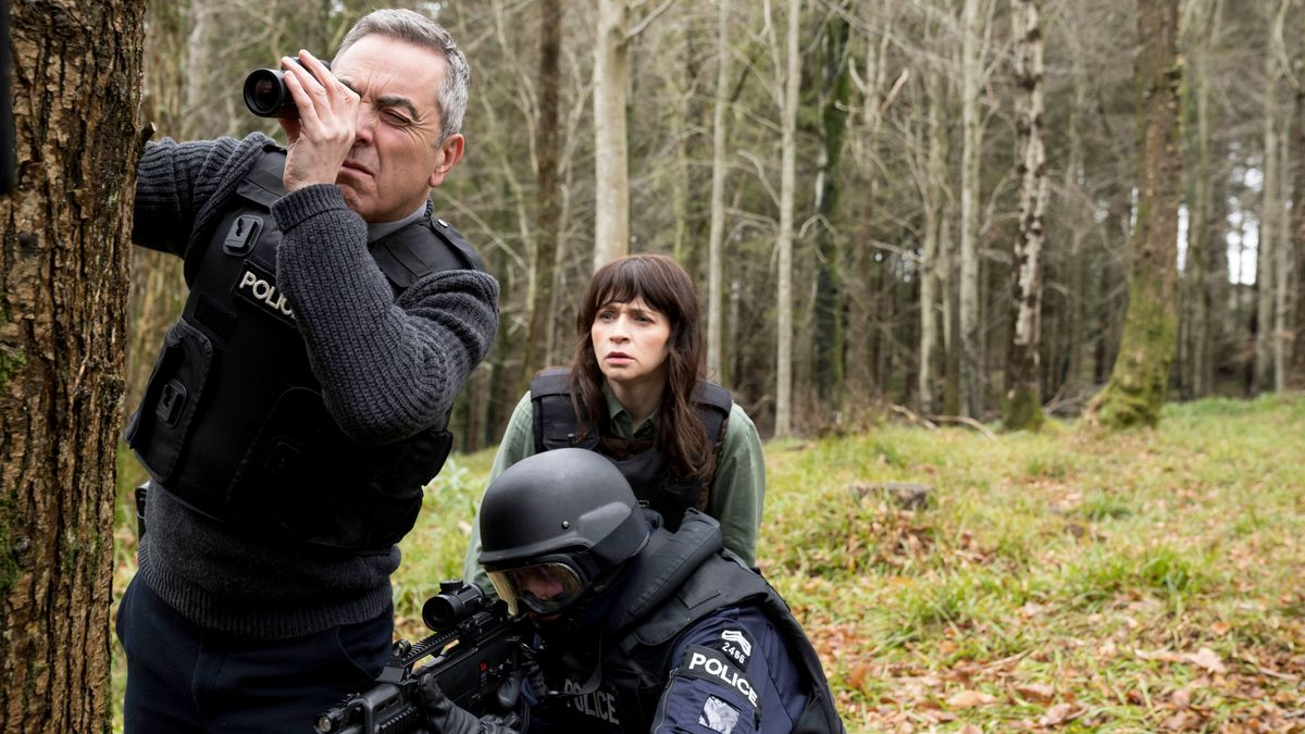 Tom Brannick (James Nesbitt) and Niamh McGovern (Charlene McKenna) watch the police raid Rob Dardis house in Bloodlands season 2