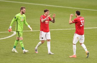 David de Gea, Victor Lindelof and Nemanja Matic celebrate after securing third spot with their win at Leicester