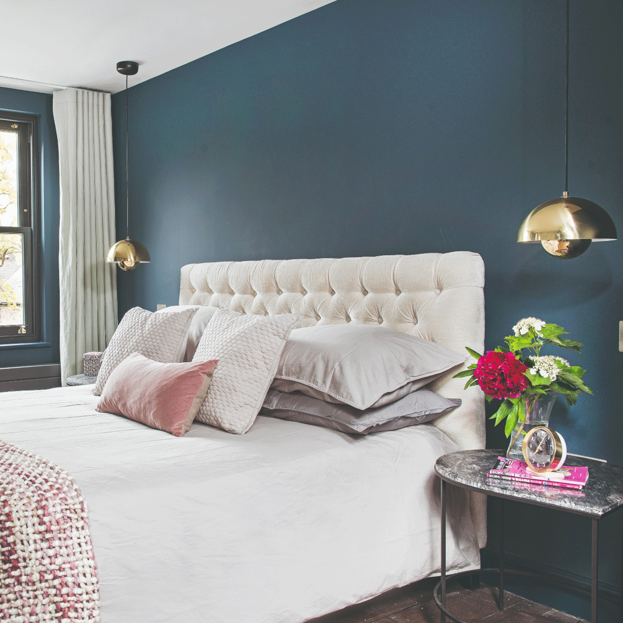 Navy blue bedroom with gold lights
