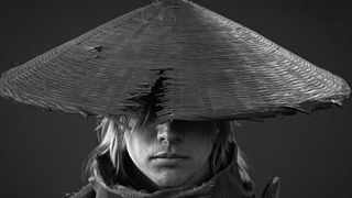 Soul from Phantom Blade Zero, a hat pulled down over his eyes