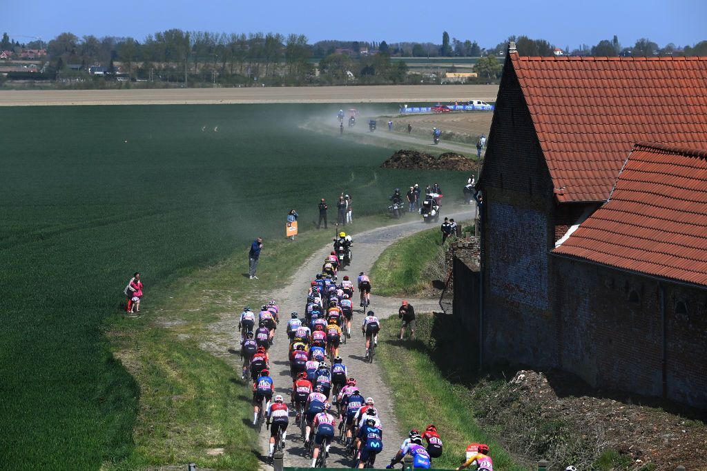 ROUBAIX FRANCE APRIL 16 A general view of the peloton compete passing through a Orchies cobblestones sector landscape during the 2nd ParisRoubaix 2022 Womens Elite a 1247km one day race from Denain to Roubaix ParisRoubaixFemmes ParisRoubaix on April 16 2022 in Roubaix France Photo by Tim de WaeleGetty Images