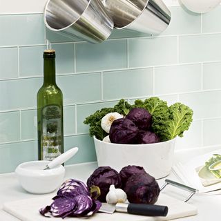 white chopping boards with veggies and knife