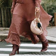 Woman in burgundy boots and dress