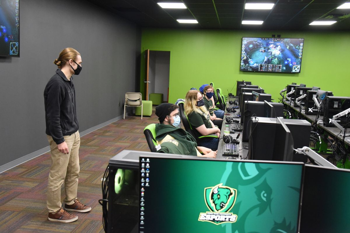 Point Park University head coach Chris Gaul oversees student competition at the new esports training facility.