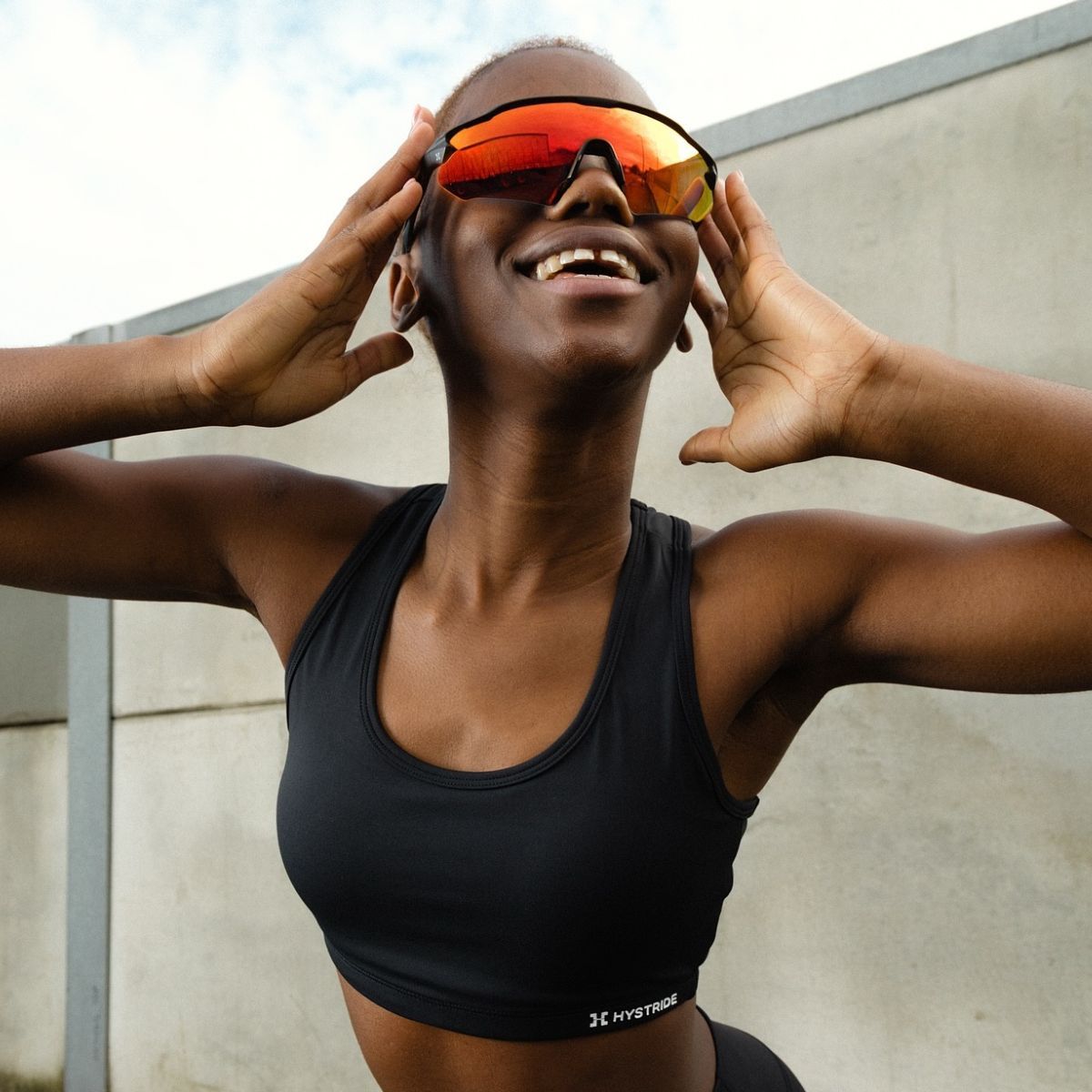 Hystride model wearing a pair of the best running sunglasses