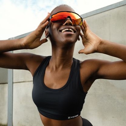 Hystride model wearing a pair of the best running sunglasses