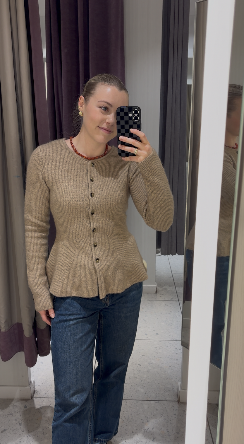 Florrie wearing a cardigan