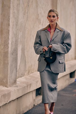 Fashion week spring/summer 24 attendee wearing grey skirt suit