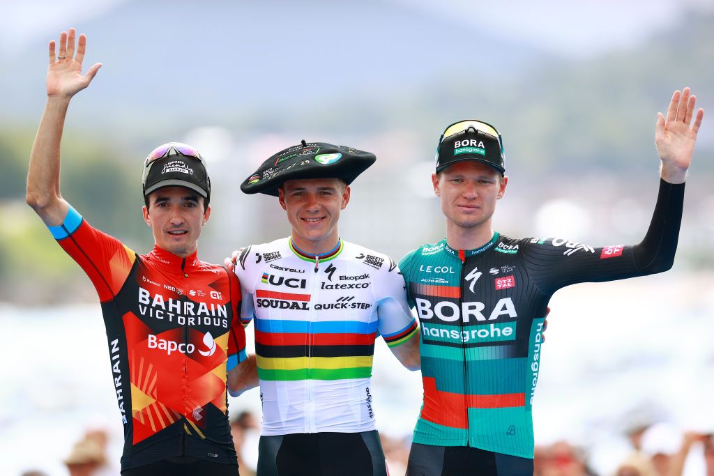 SAN SEBASTIAN SPAIN JULY 29 LR Pello Bilbao of Spain and Team Bahrain Victorious on second place race winner Remco Evenepoel of Belgium and Team Soudal Quick Step with the Txapela hat trophy and Aleksandr Vlasov of Russia and Team BORA hansgrohe on third place pose on the podium ceremony after the 43rd Donostia San Sebastian Klasikoa 2023 Mens Elite a 2303km one day race from San Sebastian to San Sebastian UCIWT on July 29 2023 in San Sebastian Spain Photo by Gonzalo Arroyo MorenoGetty Images
