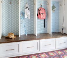 mudroom ideas with fitted cupboards and patterned flooring