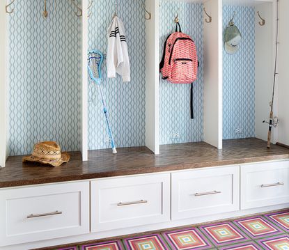 mudroom ideas with fitted cupboards and patterned flooring