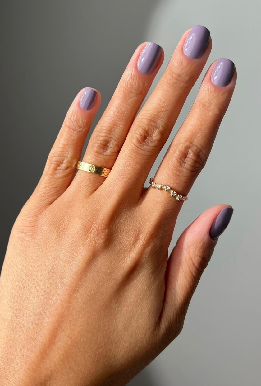 A close-up of shot of milky-lilac nails