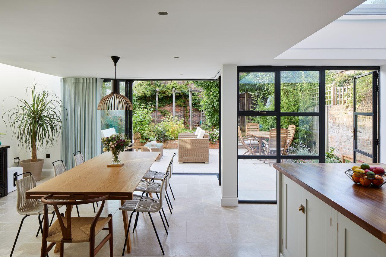 modern white kitchen diner extension with steel sliding doors