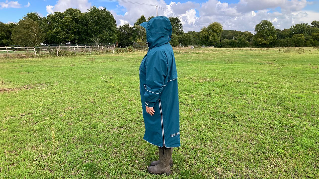 Lady wearing Two Bare Feet Hi-Vis Lightweight Riding Robe with hood up side view
