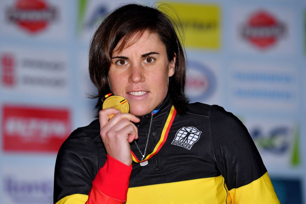 MIDDELKERKE BELGIUM JANUARY 08 Gold medalist Sanne Cant of Belgium poses on the podium after the 105th Belgian National Cyclocross Championships 2022 Womens Elite bkmiddelkerke on January 08 2022 in Middelkerke Belgium Photo by Luc ClaessenGetty Images