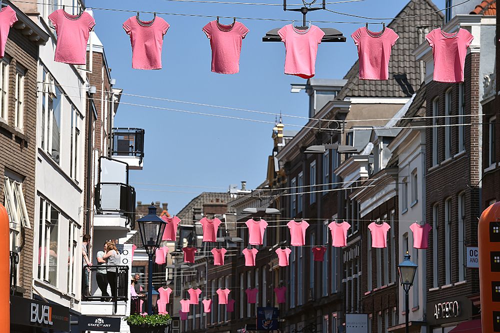 Pink jerseys line the streets
