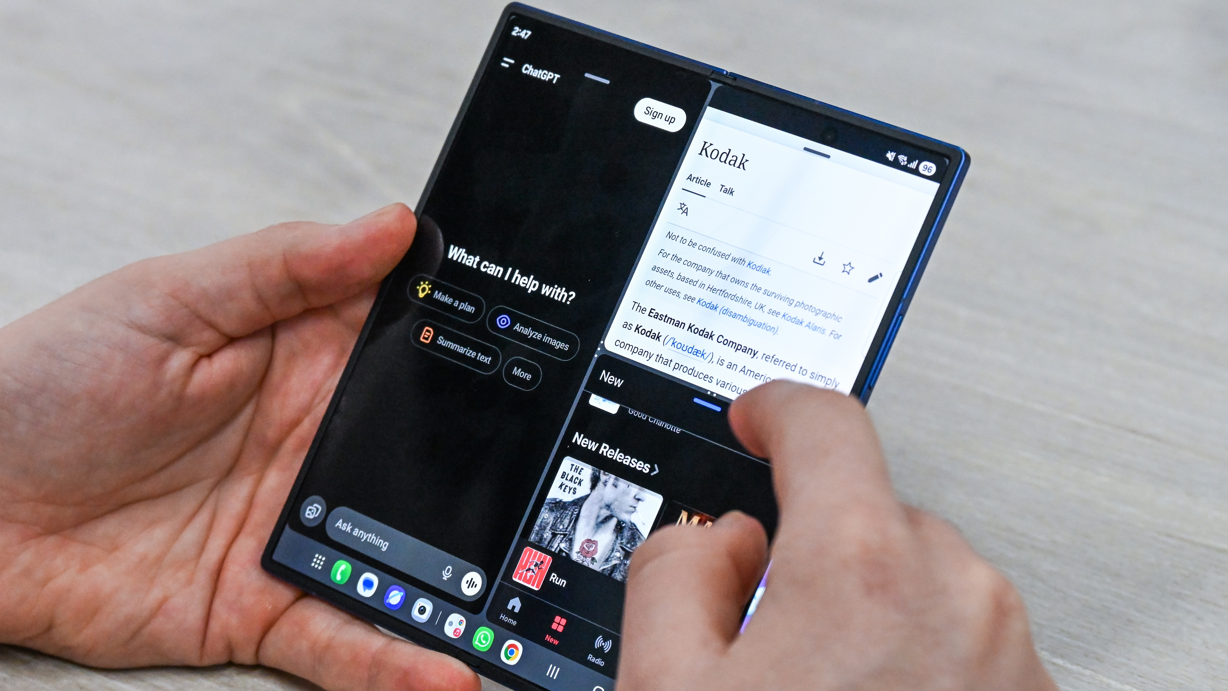 Someone using the Samsung Galaxy Z Fold 7 when unfolded, with three separate apps open at once.