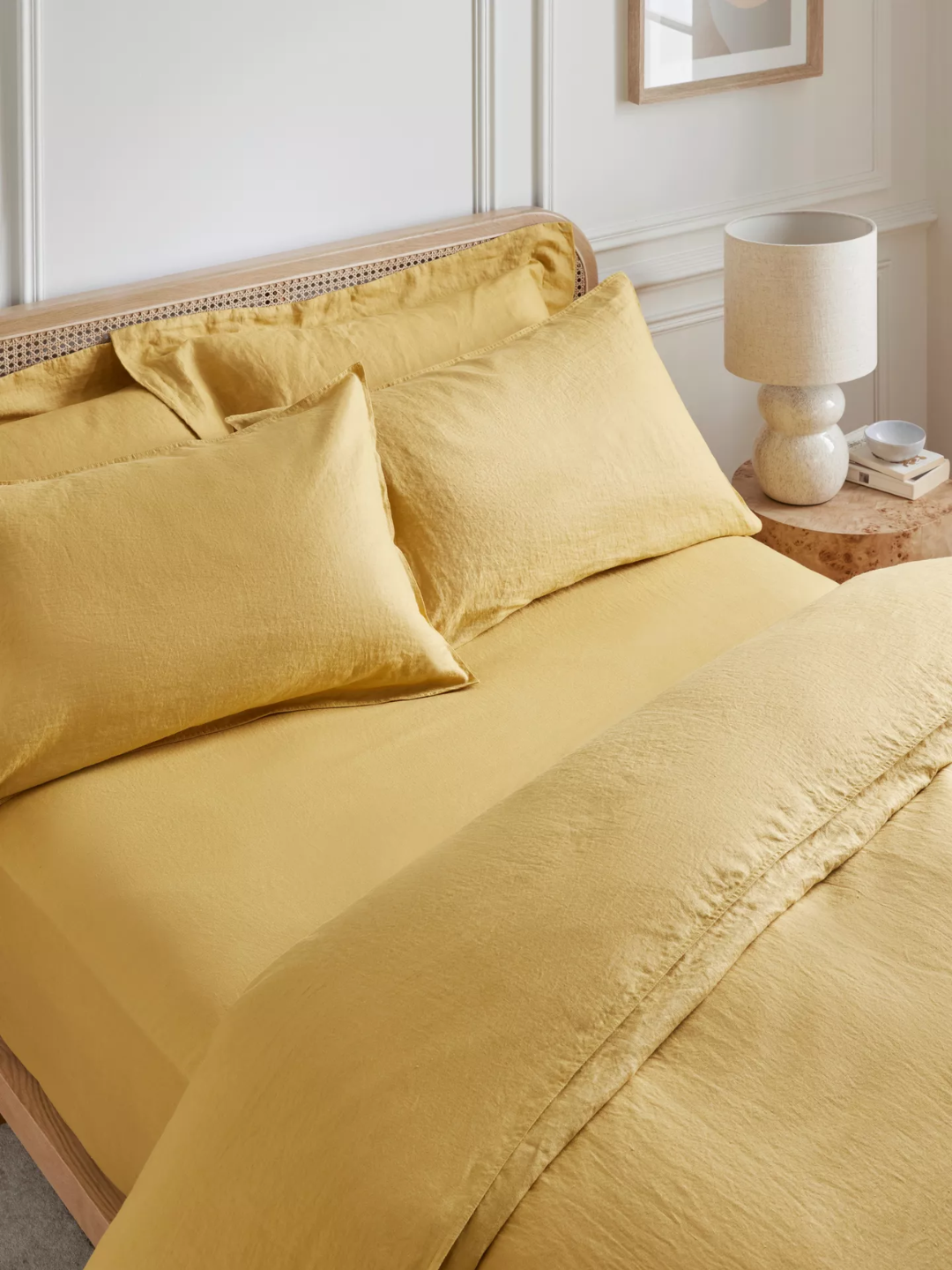 An ochre washed linen king fitted sheet from John Lewis