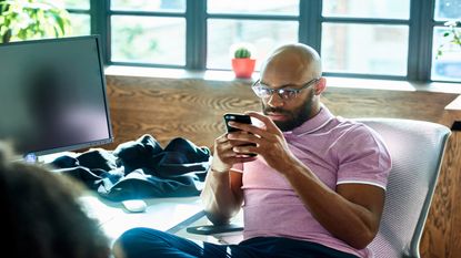 man looking at phone