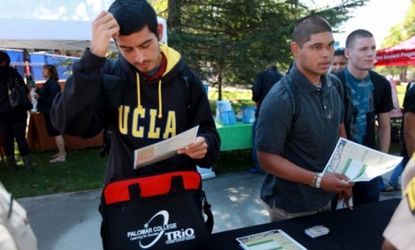 A UCLA student fills out an application during a college job fair in California: The typical college grad will make $1.42 million over a 40-year-career, according to new data.