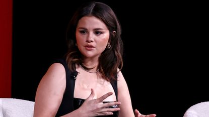 Selena Gomez wearing a black dress onstage at the 2024 TIME100 Summit at Jazz at Lincoln Center on April 24, 2024 in New York City.