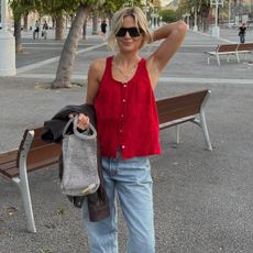 Woman in red top and jeans
