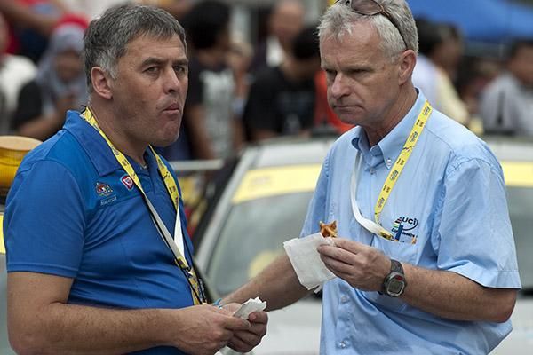 Chief Commissaire Peter Stuppacher (right) and Radio Tour Officer Hendrick Redant enjoy some waffles for brunch prior to the start of stage three in Tiaping.