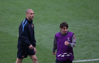 Former Barcelona manager Pep Guardiola (left) and Lionel Messi in training