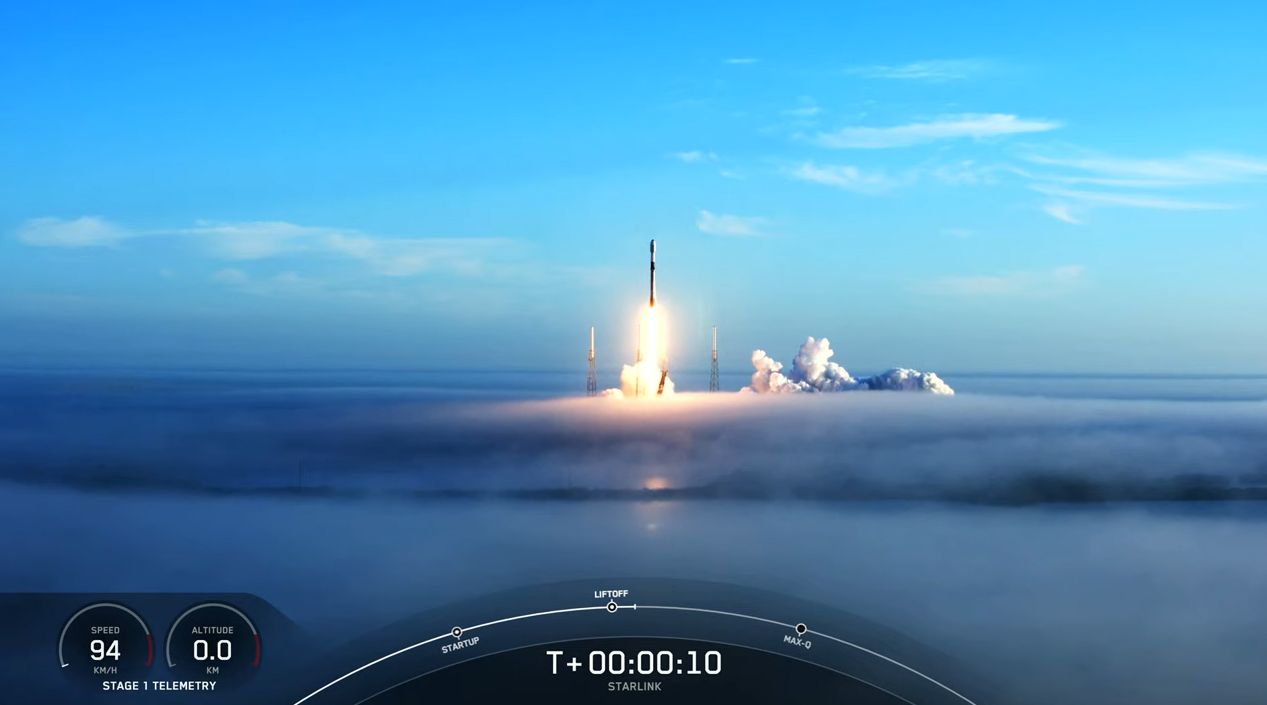 A used SpaceX Falcon 9 rocket carrying 53 Starlink internet satellites launches through a fog layer from a pad at Cape Canaveral Space Force Station in Florida on Nov. 13, 2021.