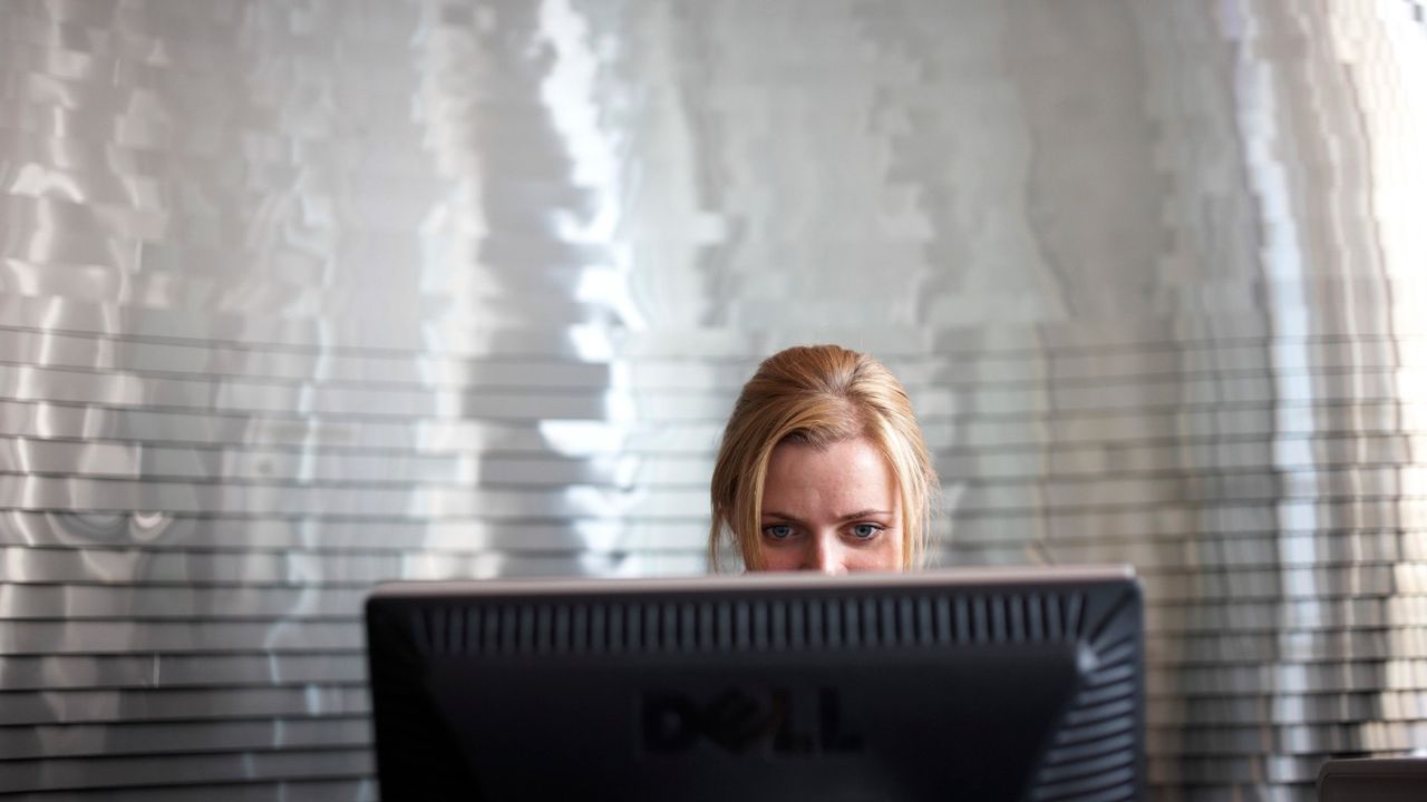 A woman at work at Ernst &amp;amp; Young