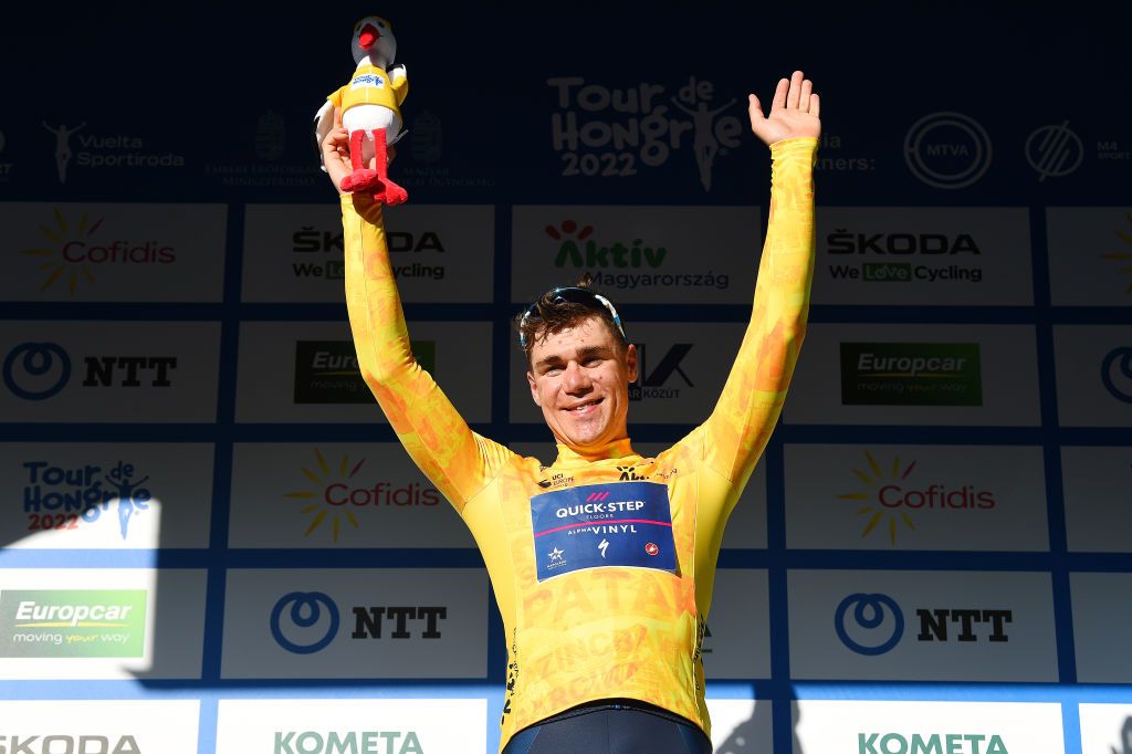 KAZINCBARCIKA HUNGARY MAY 14 Fabio Jakobsen of Netherlands and Team QuickStep Alpha Vinyl celebrates winning the yellow leader jersey on the podium ceremony after the 43rd Tour de Hongrie 2022 Stage 4 a 177km stage from Kazincbarcika to Kazincbarcika tourdehongrie on May 14 2022 in Kazincbarcika Hungary Photo by Dario BelingheriGetty Images