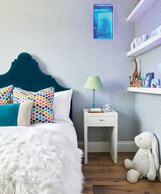 Children's bedroom with blue leopard wallpaper