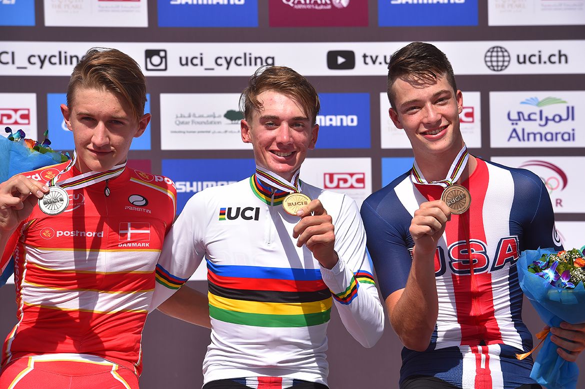 Brandon McNulty alongside Bjerg and Garrison on the podium