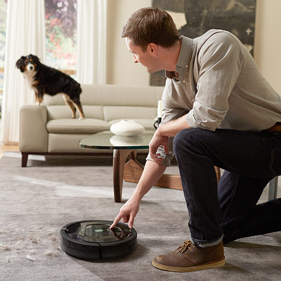 living room with cleaning robot on carpet