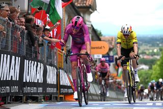 VICENZA ITALY MAY 23 LR Mads Pedersen of Denmark and Team Lidl Trek Purple Points Jersey celebrates at finish line as stage winner ahead of Wout Van Aert of Belgium and Team Visma Lease a Bike during the 108th Giro dItalia 2025 Stage 13 a 180km stage from Rovigo to Vicenza UCIWT on May 23 2025 in Vicenza Italy Photo by Dario BelingheriGetty Images