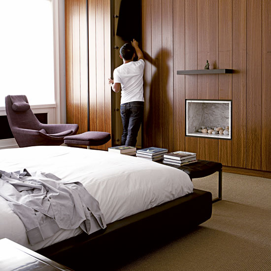 bedroom with wooden ceiling fitted cupboard and bed