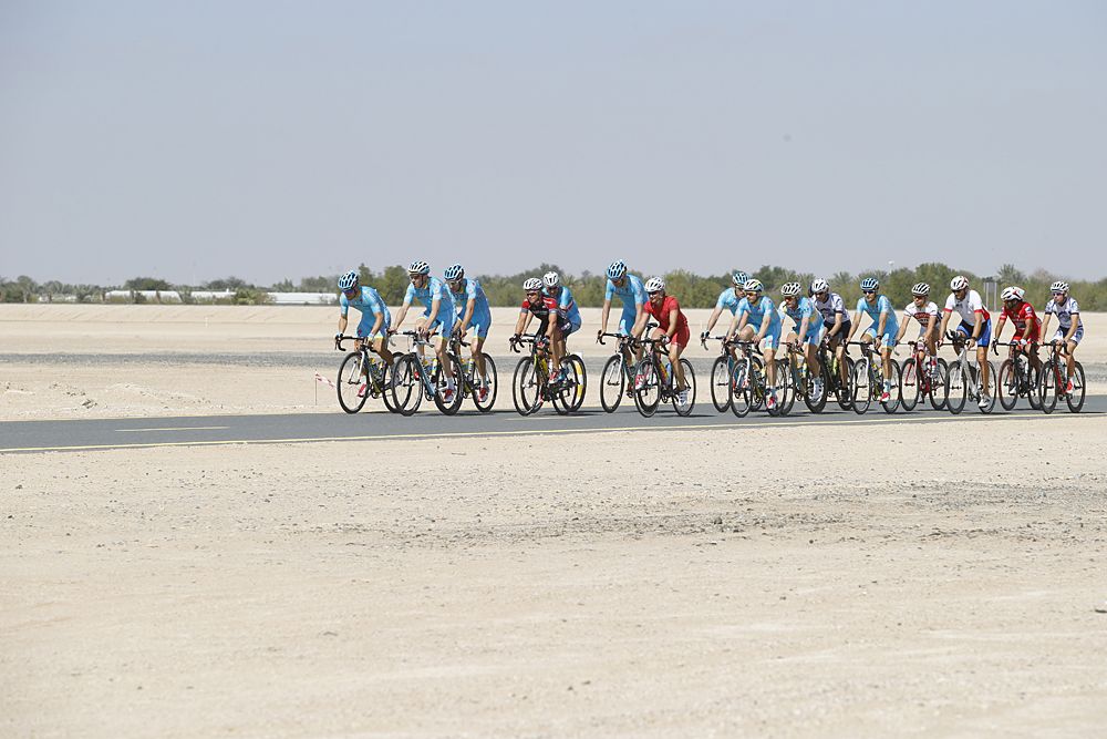 Riders shake out their legs before the team presentation in Dubai