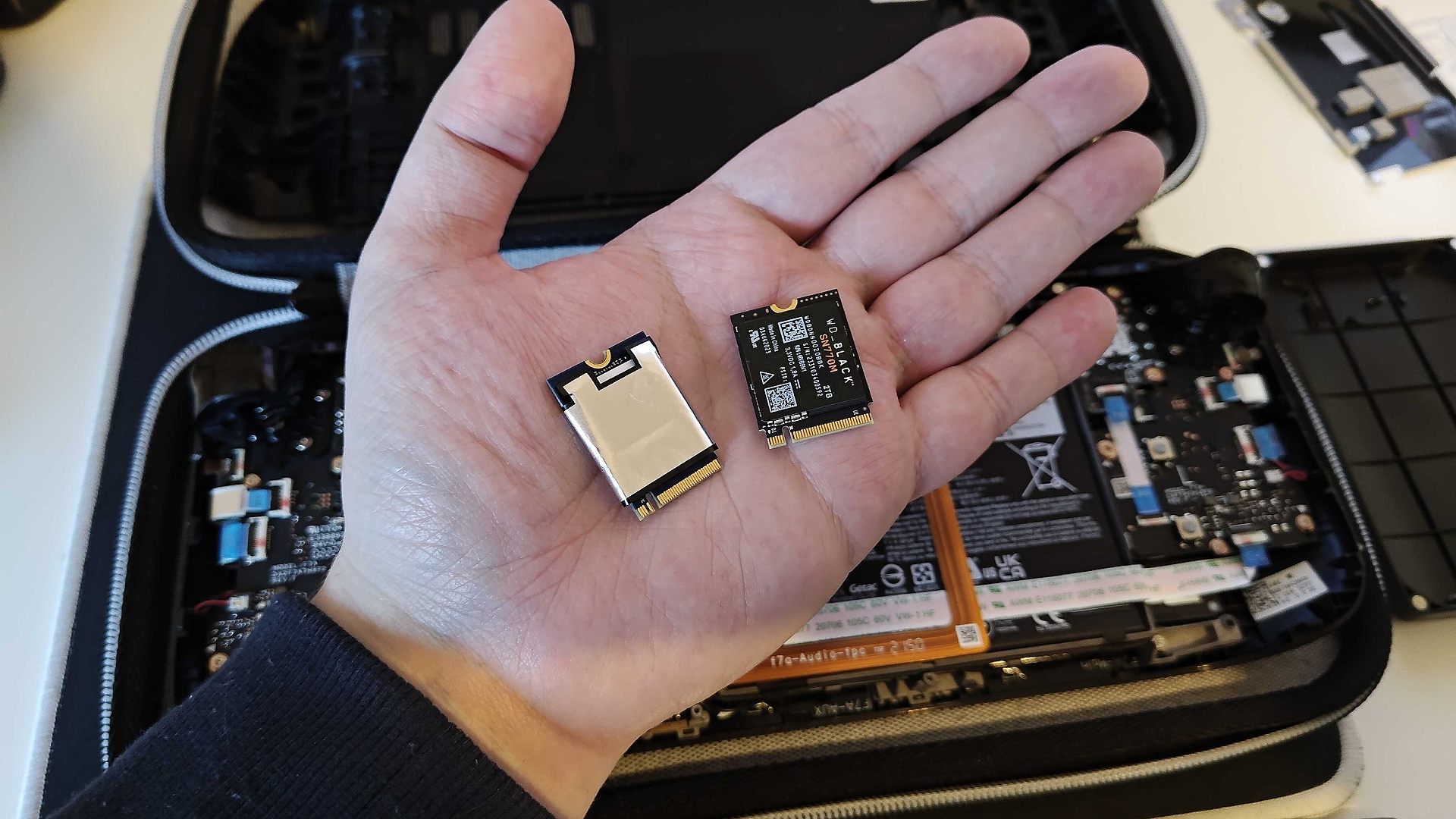 WD Black SN770M next to Kingston Steam Deck SSD in palm of hand