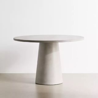 A round concrete coffee table