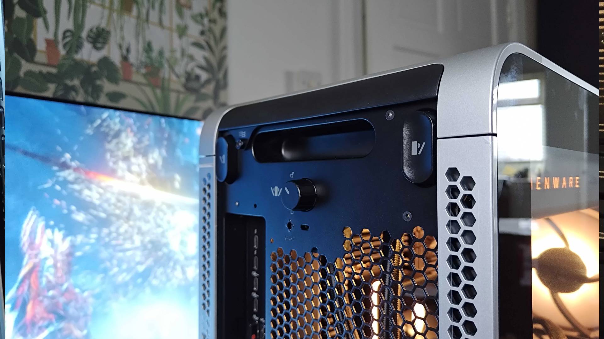 Close up of Alienware Area-51 lock at back of case.