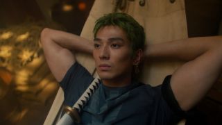 Mackenyu's Zoro leaning back in hammock in One Piece