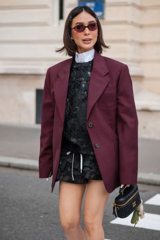 woman wearing burgundy blazer