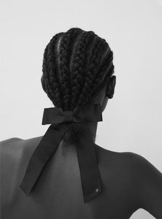Model wears hairclip by Chanel