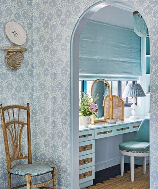dressing room with arch and aqua drawers and blind
